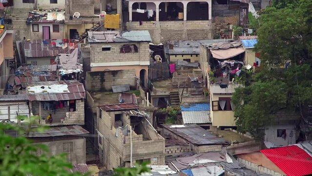 Port au Prince slum. Tilt up reveals crowded shanty town in Haiti.