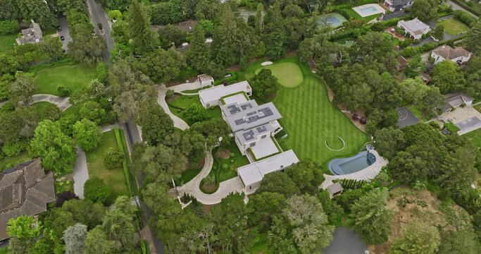 Atherton California Aerial v6 fly around high-end mansion, single family home with modern architectural designs in residential neighborhood with open green space - Shot with Mavic 3 Cine - June 2022
