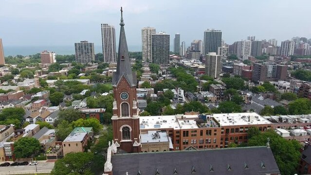 Drone Shot of St. Michaels Catholic Church in Old Town Chicago Revealing Michigan Lake Waterfront Buildinhs