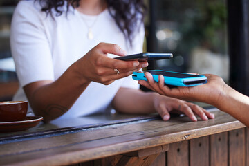 Woman, hands and phone for ecommerce, scan or transaction on wireless card machine at coffee shop....