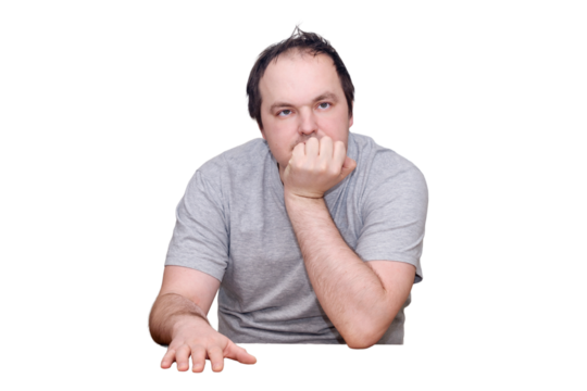 An adult man of 40 years old in casual clothes sits thoughtfully at the kitchen table. Problems in life with despair, grief, and melancholy, isolated on a white background