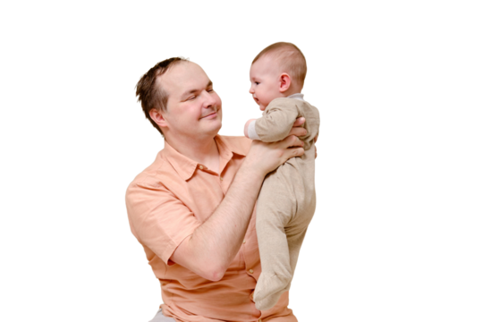 A man father and a boy son play together on the sofa in the home living room, isolated on a white background. Kid aged six months