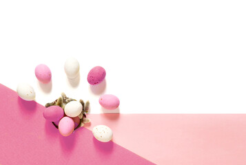 candy Easter eggs on a light white pink background. Happy easter flat lay. copy space	