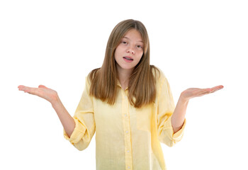 Surprised and confused fourteen year old teenager spread hands sideways, know nothing, can't understand something strange, looking puzzled at camera. Young girl posing in studio isolated on white.