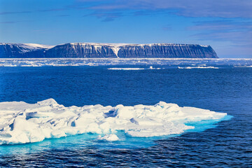 View at the rocky coastline at Svalbard with ice floes © Lars Johansson