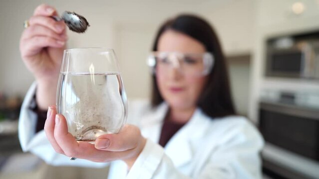 Soil test, female agricultural scientist conducting a soil test in a scientific lab in. soil agricultural agronomist in australia, soil microbial test in a scientific lab. Soil microbes