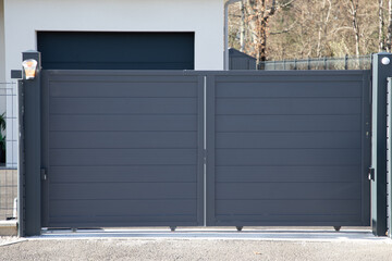 Aluminum design grey metal double gate of modern suburb house entrance closed door