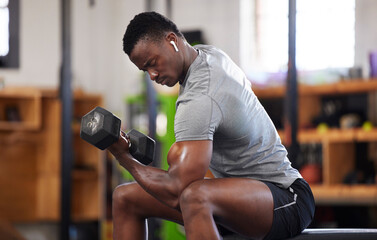 Fitness, dumbbell and black man doing a workout in the gym for intense arm strength training....