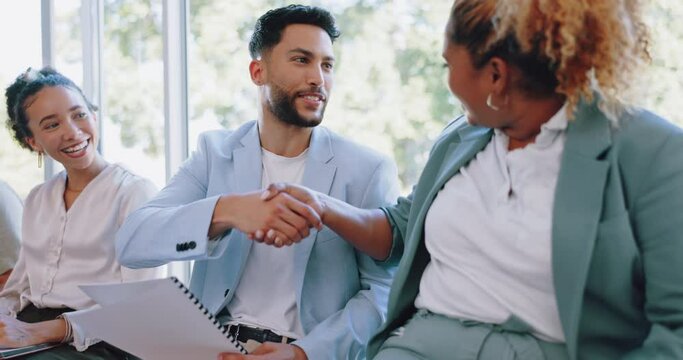 Recruitment, handshake and business people networking in job interview waiting room, happy and friendly. We are hiring, job opportunity and hand shaking by man and woman relaxing in line at startup