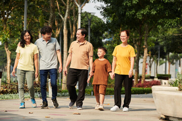 Family Walking in Sunny Park