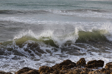Morning bright blue skies with transparent white clouds and restless deep sea. Feeling calm, cool, relaxed.