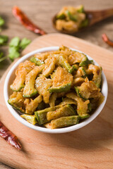 traditional food shredded pickled turnip (chopped preserved radish) on table.