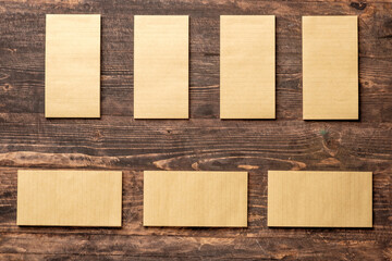 top view of group of yellow notepad align on wood table