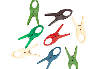 Colorful plastic cloth pins on white isolated background
