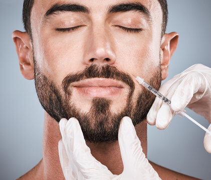 Face injection, man and aesthetic for skincare, collagen and beauty process in studio. Cosmetics, needle and male plastic surgery for botox transformation, medical change and facial prp on background