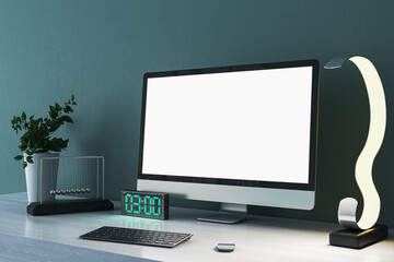 Close up of creative designer desk top with empty white mock up computer monitor, supplies and various items on blue concrete wall background. 3D Rendering.