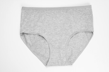 a gray cotton panties on a white background. the concept of classic underwear made of natural...