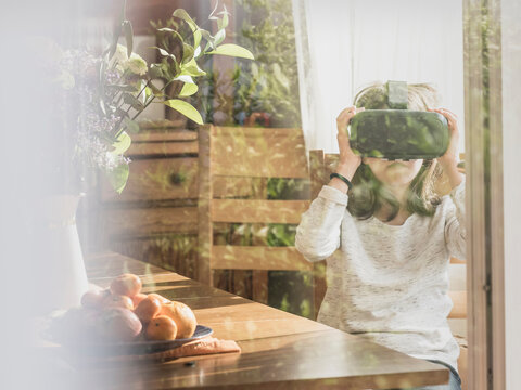 Girl wearing virtual reality glasses