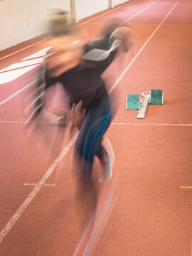 Blurred motion of women running on tartan track, Offenburg, Baden-W&uuml;rttemberg, Germany