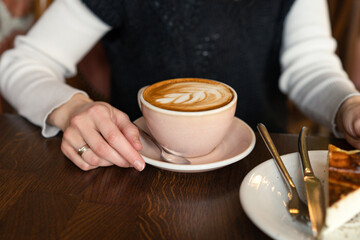 Ready to drink coffee in restaurant. Morning breakfast with coffee and dessert