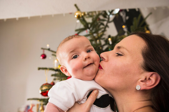 Mother kissing baby boy