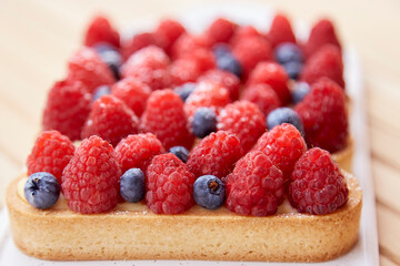Close up of natural french sugar free blueberry and raspberry tartlets close up. Top view food. Aesthetic food