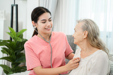 Nurse using stethoscope to check the heart senior woman at home or nursing home,Home nursing and healthcare caregiver concept.