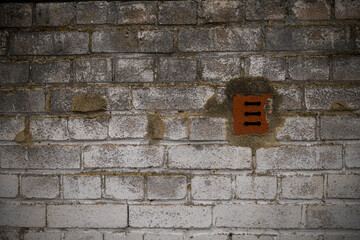 Fototapeta na wymiar an old porous brick wall