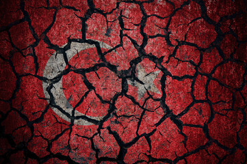 Earthquake in Turkey. Turkey flag on the cracked earth. Cracked Turkey flag.