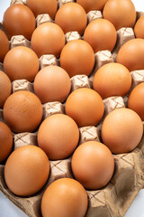Dozen chicken  eggs in carton box on white background, Eggs in cardboard box on White background.