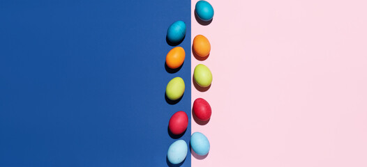 Bright painted eggs for Easter celebration on color background