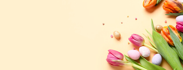 Festive composition with beautiful tulip flowers and Easter eggs on light background with space for text
