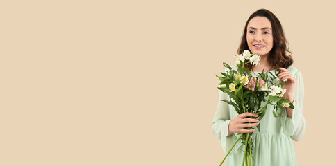 Beautiful young woman with bouquet of alstroemeria flowers on beige background with space for text