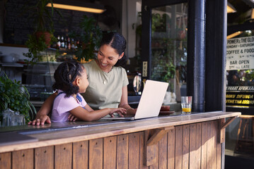 Black family, coffee shop or laptop with a mother and daughter together in the window of a...