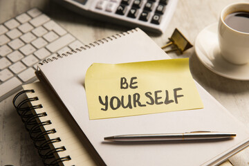 It says be yourself on paper.