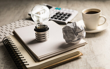 Notepads and light bulb.