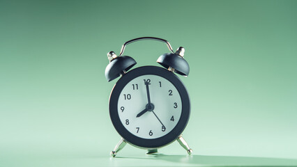 Blue clock showing eight o'clock on green background. Time, timetable, countdown, alarm clock, schedule, deadline.