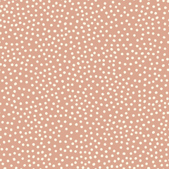 Seamless neutral polka dots pattern. White hand-drawn circles isolated on beige background. Abstract Random points ornament. Vector illustration for wallpaper, fabric, print, wrapping paper, textile