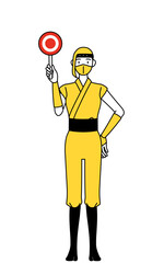 正解を示すマルの棒を持つ忍者のコスプレをした女性