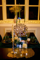 Romantic dinner table setting with festive lights