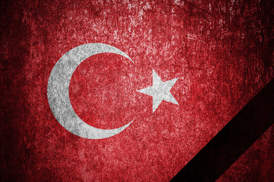 The national flag of Turkey with a black mourning ribbon. Mourning for Turkey.