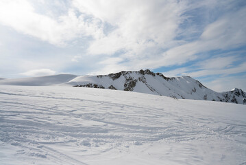 Fototapeta na wymiar White sunny snow mountain landscapes