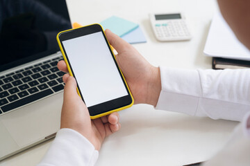 Close up of a man using mobile smart phone.