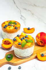 peaches blueberry chia yogurt. Homemade dessert with fruits. place for text, top view