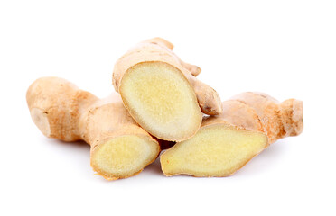 Pieces of ginger roots on white background