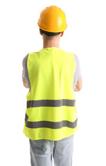Male worker in vest and hardhat on white background, back view