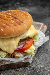 burger with melted cheese, Big cheeseburger with lots of cheese