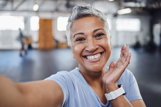 Selfie, gym and fitness senior woman taking picture after exercise, workout or training with a smile. Elderly, old and portrait of a fit female happy for wellness, health and update social media