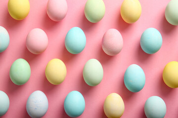 Composition with painted Easter eggs on pink background