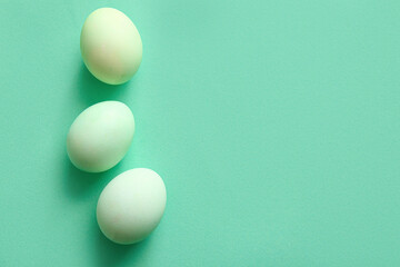 Beautiful Easter eggs on color background
